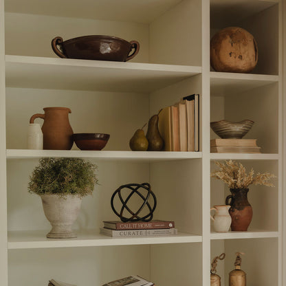 Chestnut stoneware bowl styled on open shelving with rustic decor