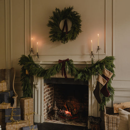 Faux Cedar Wreath styled with cowbells and velvet ribbon for Christmas