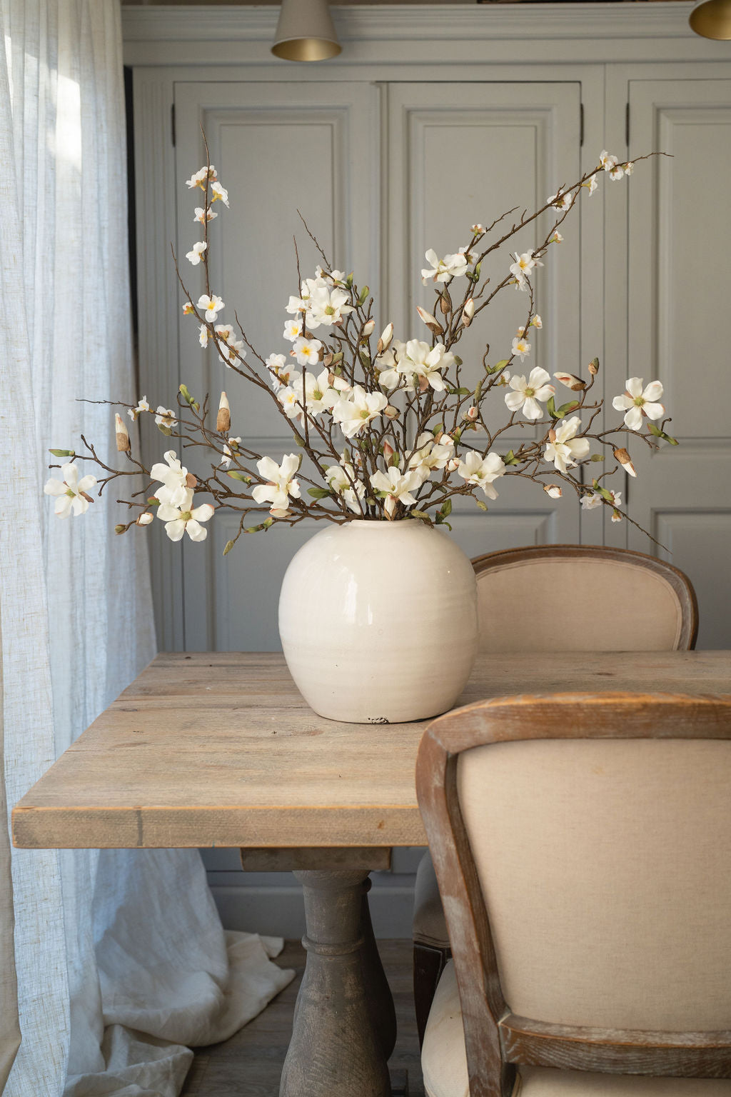 Open Magnolia and Apple Blossom Arrangement